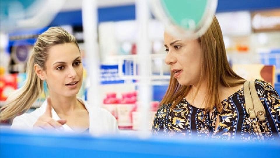 Two women in a pharmacy